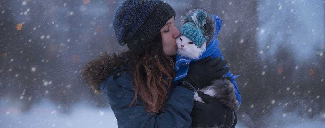 Girl with Cat in the Snow